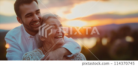 Man Embracing Woman at Sunset 114370745
