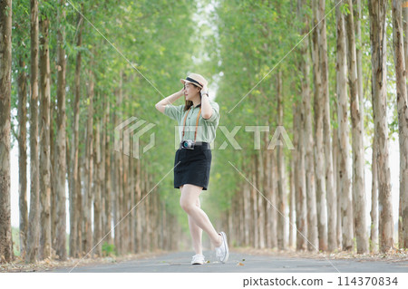 asian woman happy with travel and relax at outdoor on spring season 114370834