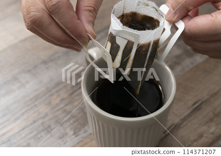 Brewing coffee: pouring hot water Brewing coffee: pouring hot water 114371207