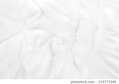 Close up top view of white bedding sheet and wrinkle messy blanket in bedroom after wake up in the morning. 114371946