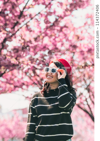 portrait of smiling beautiful woman in sunglasses portrait of smiling beautiful woman in sunglasses 114372406