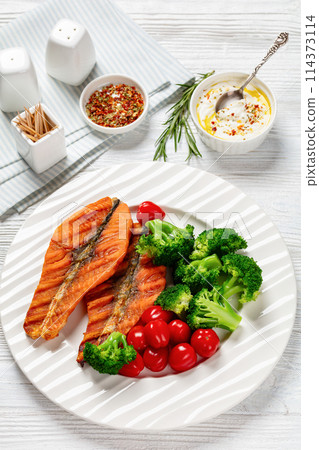 grilled salmon steaks with broccoli and tomatoes grilled salmon steaks with broccoli and tomatoes 114373114