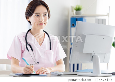 Medical: Female doctor conducting online consultation 114373127