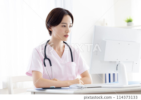 Medical: Female doctor conducting online consultation 114373133