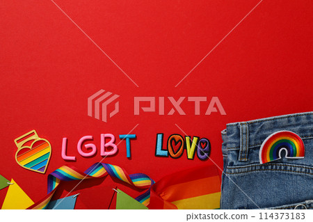 LGBT parade concept, colorful symbols on red background. LGBT parade concept, colorful symbols on red background. 114373183