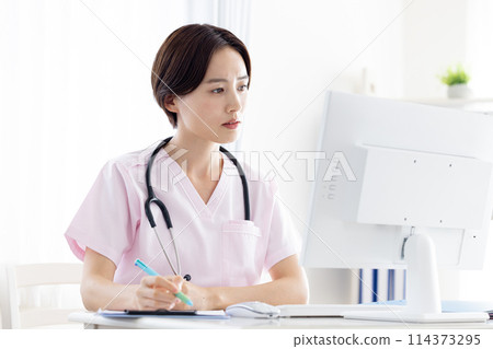 Medical: Female doctor conducting online consultation 114373295