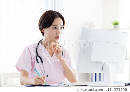 Medical: Female doctor conducting online consultation 114373296