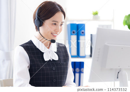 woman working in a call center woman working in a call center 114373532