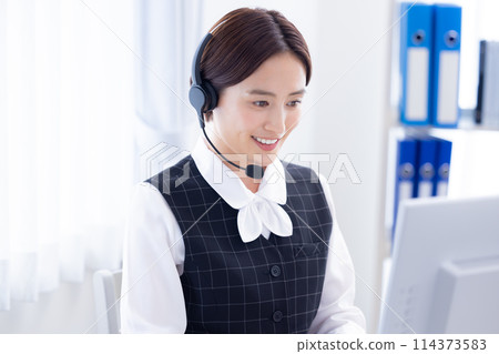 woman working in a call center woman working in a call center 114373583