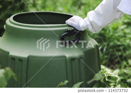 Woman with compost Woman with compost 114373732