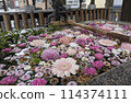 A shrine and flower water fountain blending into a residential area 114374111