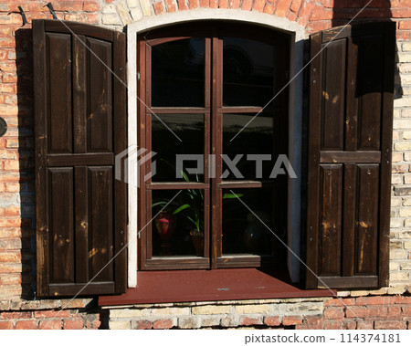 Wooden shutters, rustic building Wooden shutters, rustic building 114374181
