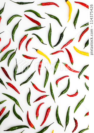 Colorful chili peppers on a white background 114375426