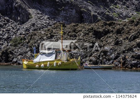 Greece, Santorini, yellow boat in the hot thermal waters Greece, Santorini, yellow boat in the hot thermal waters 114375624