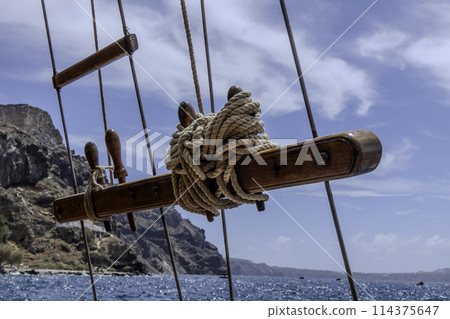 Greece, Santorini, Railing of a traditional sailboat in the port of Fira Greece, Santorini, Railing of a traditional sailboat in the port of Fira 114375647