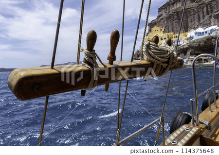 Greece, Santorini, Railing of a traditional sailboat in the port of Fira 114375648