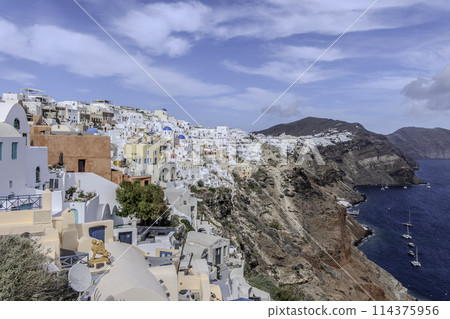 Greece, Santorini, Oia, Traditional houses of the village with blue dome Greece, Santorini, Oia, Traditional houses of the village with blue dome 114375956