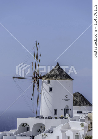 Greece, Santorini, Oia, view of the village with windmill Greece, Santorini, Oia, view of the village with windmill 114376115