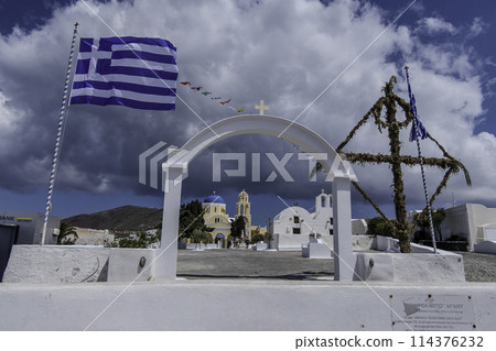 Greece, Santorini, Oia, Facade of the Orthodox church, Agios Giorgios, with a Greek flag Greece, Santorini, Oia, Facade of the Orthodox church, Agios Giorgios, with a Greek flag 114376232