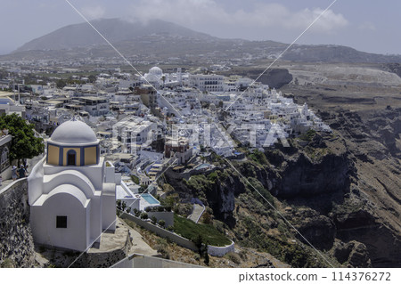 Greece, Santorini, Fira, Landscape of the capital with the Church of Saint Stylianos 114376272