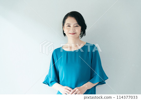 A woman smiling at the camera 114377033