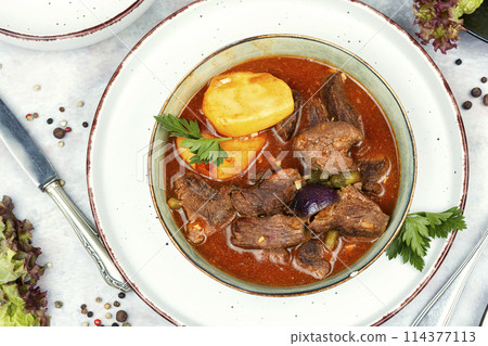 Roast venison with potatoes. 114377113