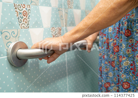 Asian elderly woman use bathroom handle security in toilet, healthy strong medical concept. Asian elderly woman use bathroom handle security in toilet, healthy strong medical concept. 114377425