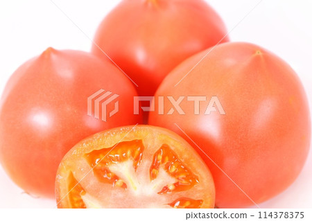 Medium size tomato cut cross section bright background Medium size tomato cut cross section bright background 114378375