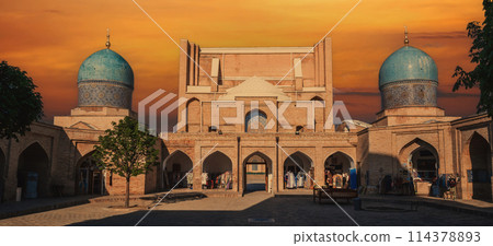 ancient Islamic muslim madrasah Barak Khan in Tashkent in Uzbekistan. Architectural complex Hazrati Imam at sunset ancient Islamic muslim madrasah Barak Khan in Tashkent in Uzbekistan. Architectural complex Hazrati Imam at sunset 114378893