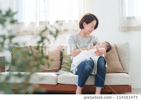 A mother holding a baby A mother holding a baby 114381473