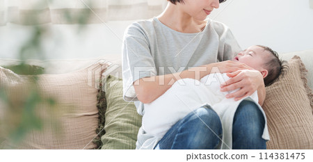 A mother holding a baby A mother holding a baby 114381475