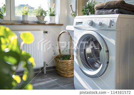 Scene of an empty bathroom with a drum-type washing machine Scene of an empty bathroom with a drum-type washing machine 114381572