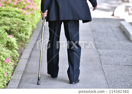 Yokohama cityscape in Japan: Aging society. Man with a cane... = Yokohama city 114382360