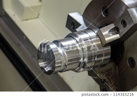 Close up scene the metal shaft parts chucking at the CNC lathe machine. 114383216