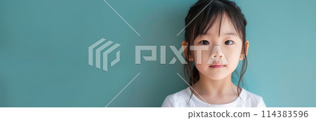 Asian child girl 4-6 years old in a white T-shirt without a pattern against the background of a colored wall, banner Asian child girl 4-6 years old in a white T-shirt without a pattern against the background of a colored wall, banner 114383596