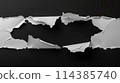 A torn piece of paper with a black background 114385740