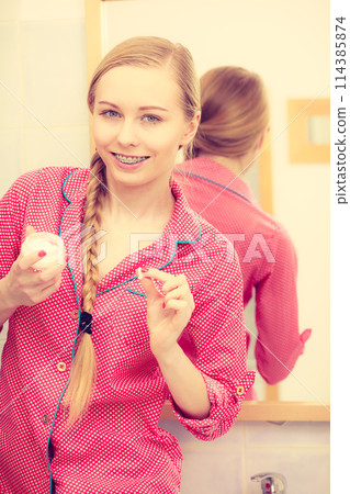 Woman applying moisturizing skin cream. Skincare. 114385874