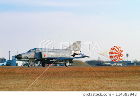 An Air Self-Defense Force F-4EJ Kai fighter jet landing with its drag chute extended An Air Self-Defense Force F-4EJ Kai fighter jet landing with its drag chute extended 114385948