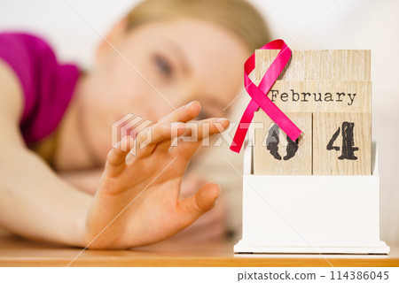 Woman on bed, world breast cancer day on calendar Woman on bed, world breast cancer day on calendar 114386045