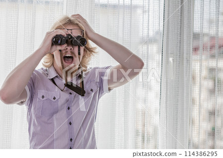 Man with binoculars spying on neighbors Man with binoculars spying on neighbors 114386295