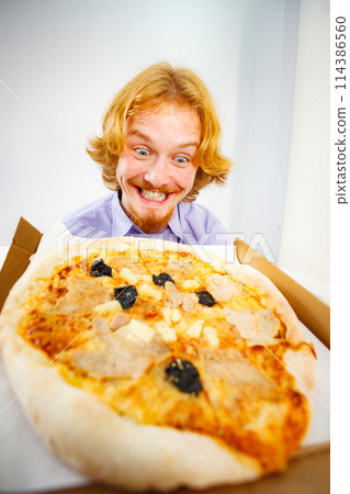 Man eating pizza, having fun. Man eating pizza, having fun. 114386560