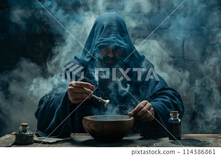 The medieval alchemist make magic ritual at the table in his smoke laboratory. 114386861