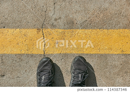 Standing behind the line 114387346