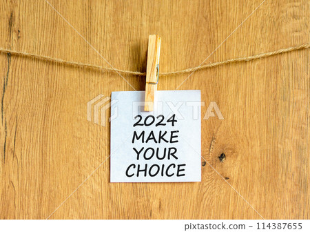 2024 Make your choice symbol. Concept words 2024 Make your choice on beautiful white paper on clothespin. Beautiful wooden background. Business 2024 Make your choice concept. Copy space 114387655