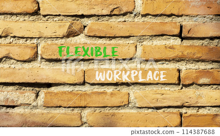 Flexible workplace symbol. Concept words Flexible workplace on beautiful brick wall. Beautiful red brown brick wall background. Business Flexible workplace concept. Copy space. 114387688