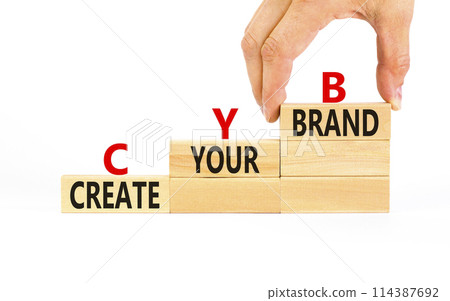 CYB Create your brand symbol. Concept words CYB Create your brand on beautiful wooden blocks. Beautiful white background. Businessman hand. Business CYB Create your brand concept. Copy space. CYB Create your brand symbol. Concept words CYB Create your brand on beautiful wooden blocks. Beautiful white background. Businessman hand. Business CYB Create your brand concept. Copy space. 114387692