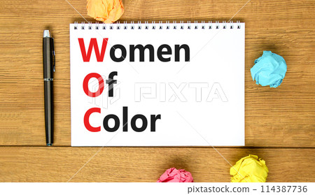 WOC women of color symbol. Concept words WOC women of color on beautiful white note. Beautiful wooden table wooden background. Business WOC women of color social issues concept. Copy space. WOC women of color symbol. Concept words WOC women of color on beautiful white note. Beautiful wooden table wooden background. Business WOC women of color social issues concept. Copy space. 114387736