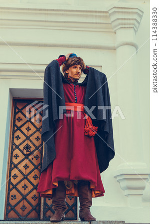 Portrait of a man in a medieval middle class costume. Retro style and historical clothes concepts Portrait of a man in a medieval middle class costume. Retro style and historical clothes concepts 114388330