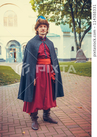 Portrait of a man in a medieval middle class costume. Retro style and historical clothes concepts 114388331