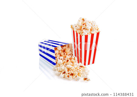 Glass with popcorn on a white background 114388431